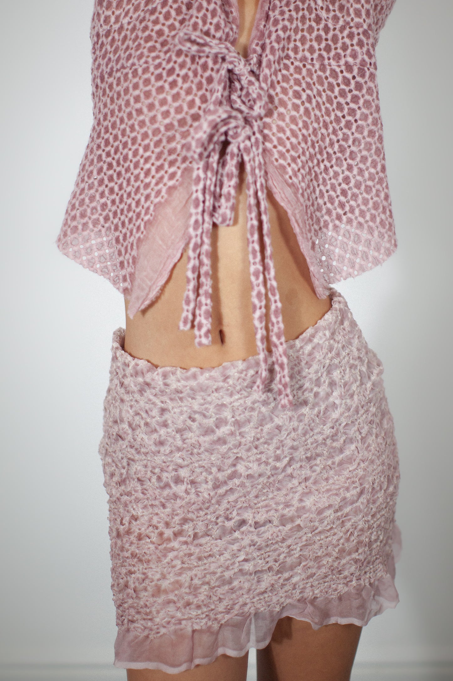  tube skirt crafted from delicate silk with a ruched fabric design.pale pink silk