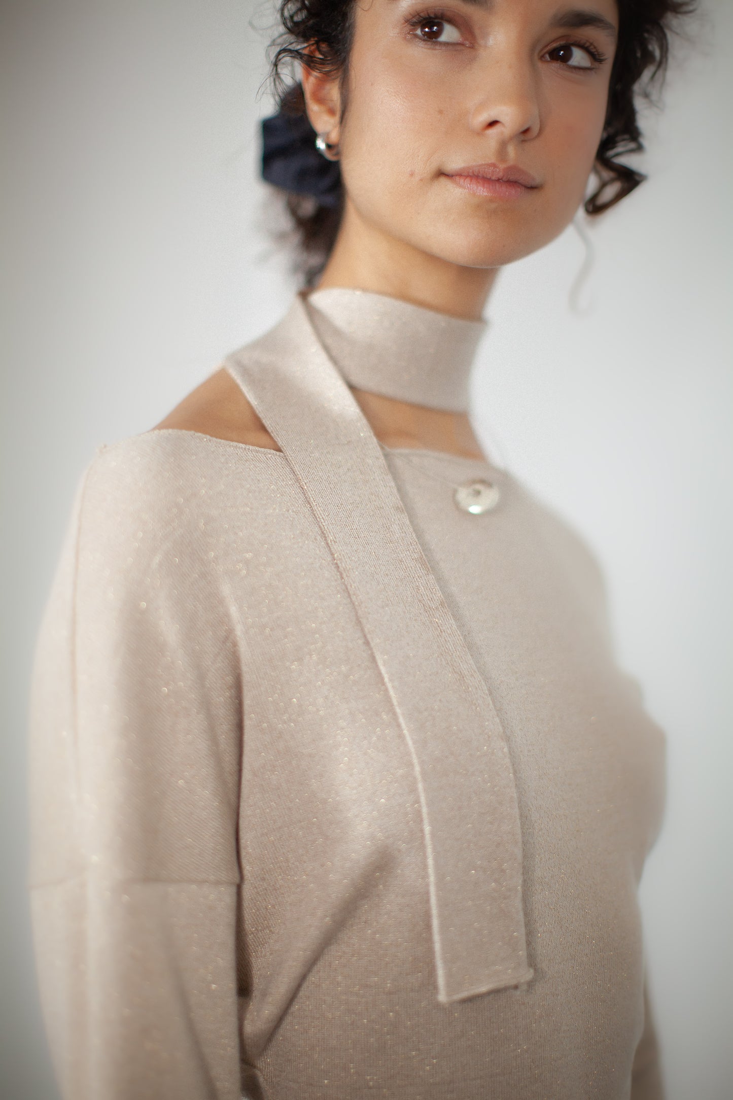 "ARAH Sweater: Luxurious jersey blend with a subtle shine. Classic boat neckline, optional coordinating scarf. Elevate your look with this chic, versatile piece."